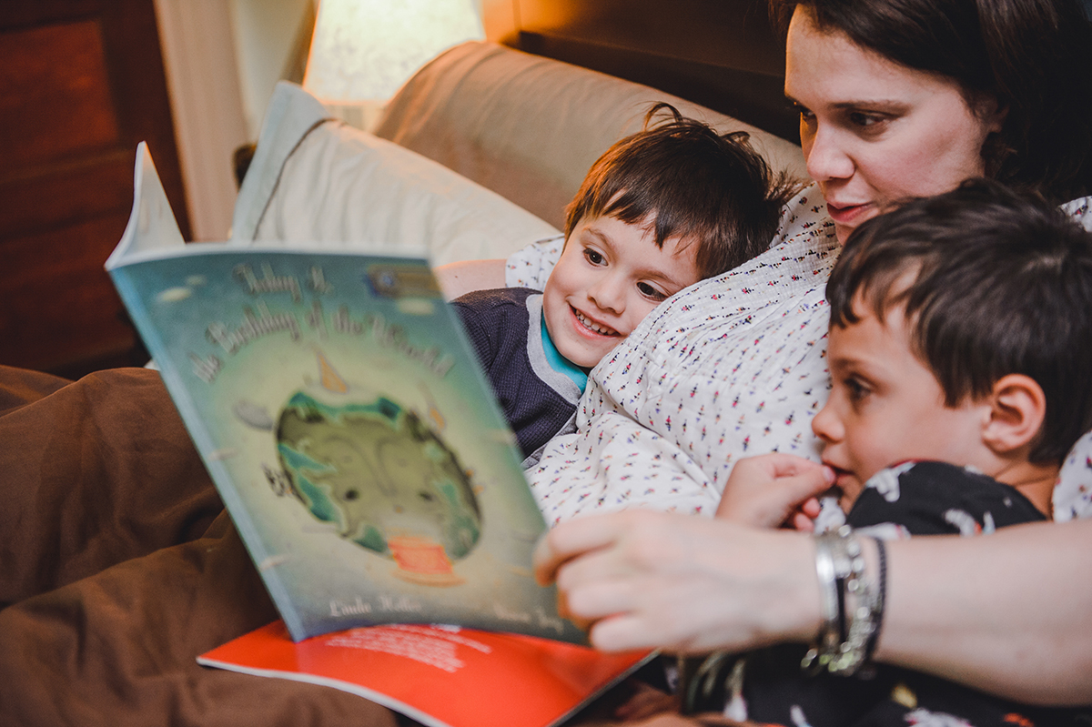 A mother reads to her children