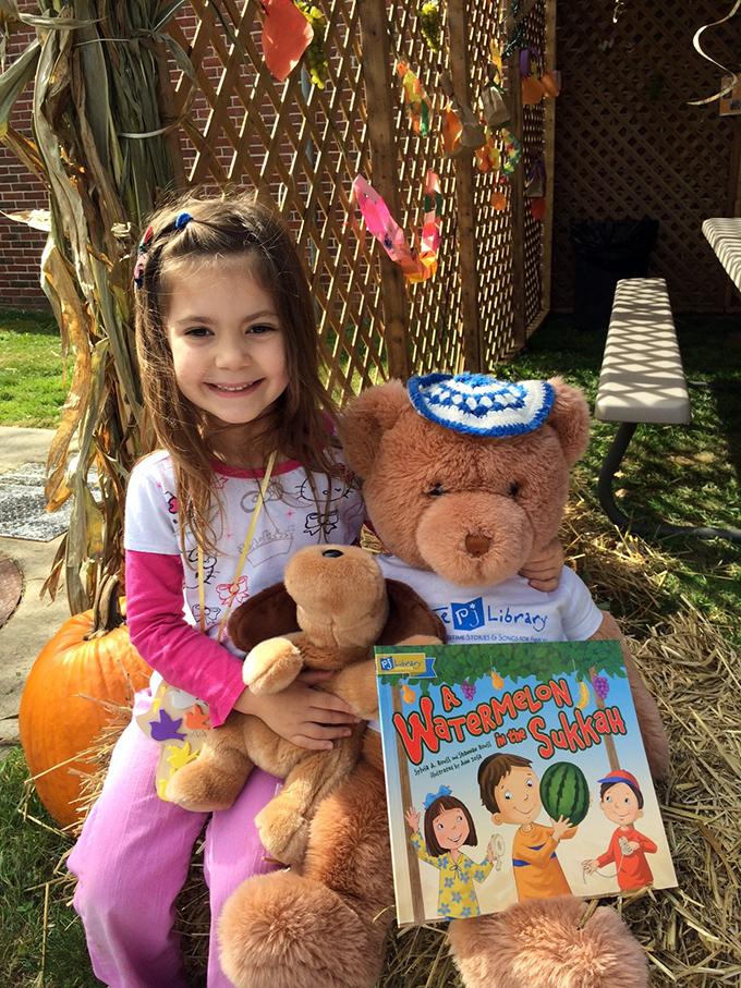 Reading Watermelon in the Sukkah in a sukkah